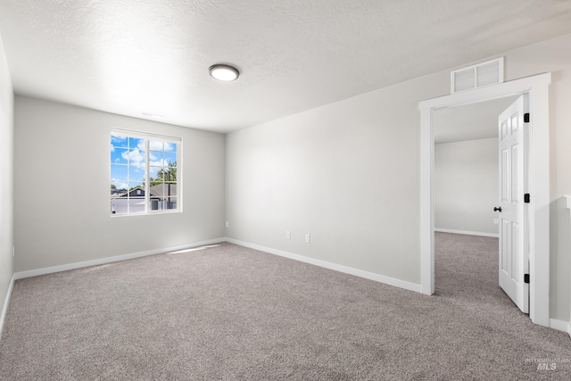 19920 Lenape Ct, Caldwell, ID 83605 - carpeted empty room featuring baseboards and a textured ceiling