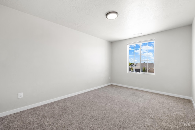 19920 Lenape Ct, Caldwell, ID 83605 - carpeted empty room featuring baseboards and a textured ceiling
