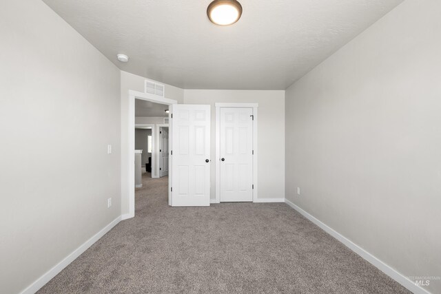 19920 Lenape Ct, Caldwell, ID 83605 - unfurnished bedroom featuring carpet and baseboards