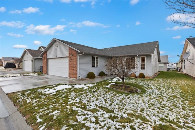 ranch-style home featuring a garage and a lawn