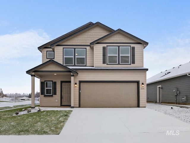 view of front facade featuring a garage and a front yard