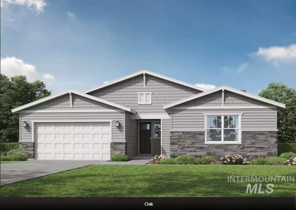 view of front of home with a garage and a front yard