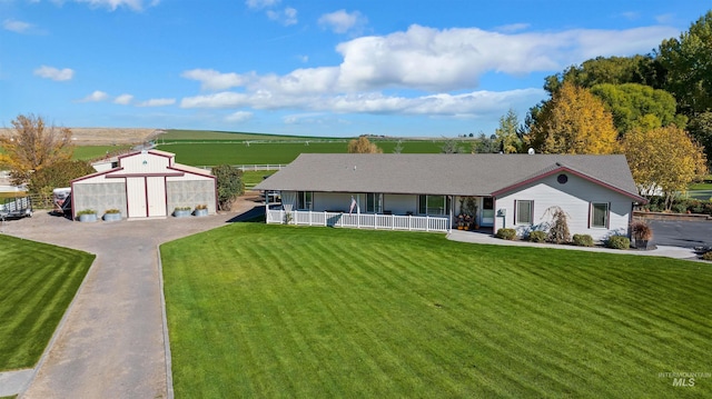 3195 N 3526e, Kimberly, ID 83341 - view of front of house featuring a porch, a front yard, and an outbuilding