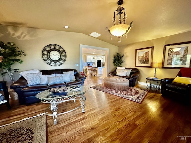 3195 N 3526e, Kimberly, ID 83341 - living area with vaulted ceiling, wood finished floors, and baseboards
