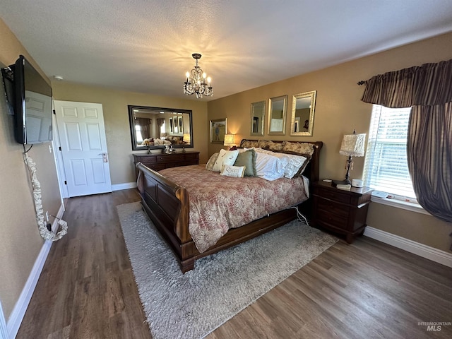 3195 N 3526e, Kimberly, ID 83341 - bedroom featuring baseboards, dark wood-style flooring, and a chandelier