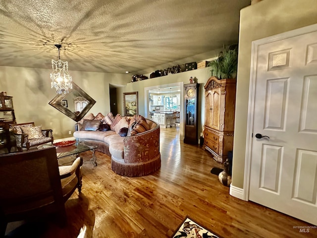 3195 N 3526e, Kimberly, ID 83341 - living area with a chandelier, wood finished floors, and a textured ceiling