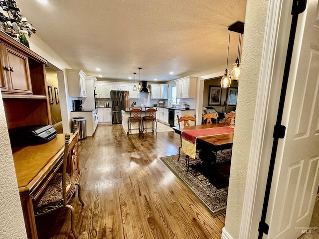 3195 N 3526e, Kimberly, ID 83341 - dining space featuring wood finished floors, recessed lighting, and a textured ceiling