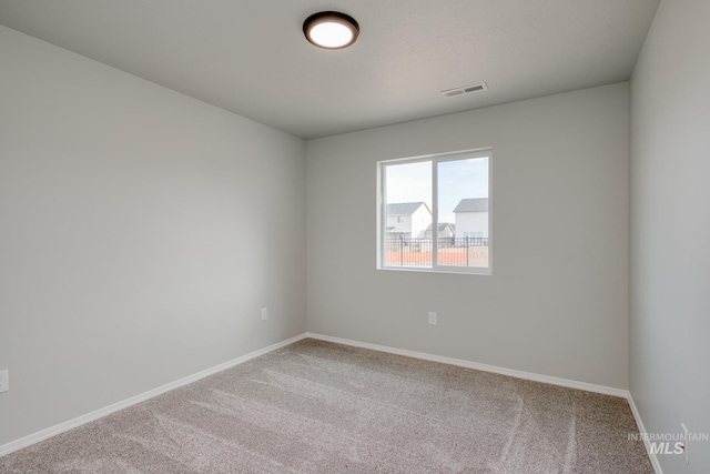 16888 Dunning Way, Caldwell, ID 83607 - spare room with baseboards, visible vents, and carpet
