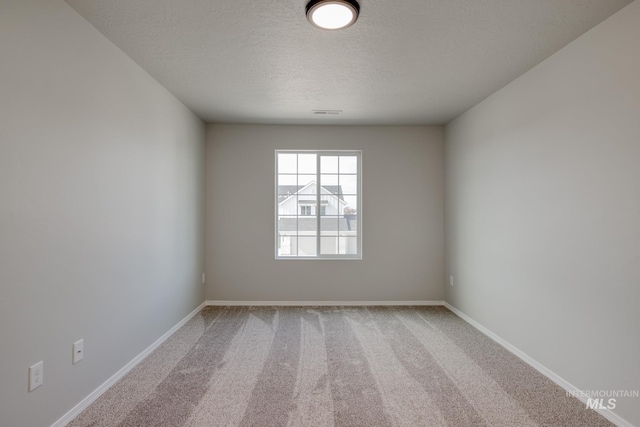 16888 Dunning Way, Caldwell, ID 83607 - carpeted empty room featuring a textured ceiling and baseboards