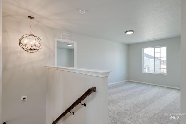 16888 Dunning Way, Caldwell, ID 83607 - interior space with an inviting chandelier, carpet floors, visible vents, and baseboards
