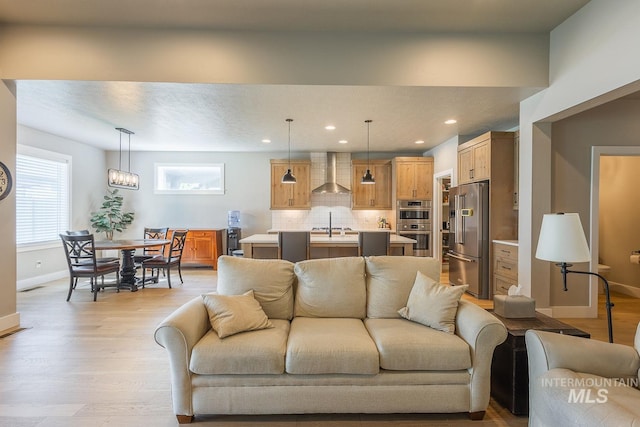 11706 W Lilium St, Star, ID 83669 - living room featuring light wood finished floors and recessed lighting