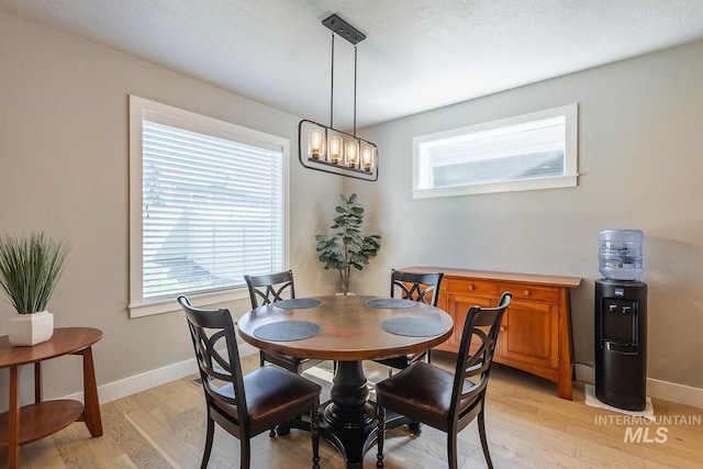 11706 W Lilium St, Star, ID 83669 - dining area with light wood-type flooring and baseboards
