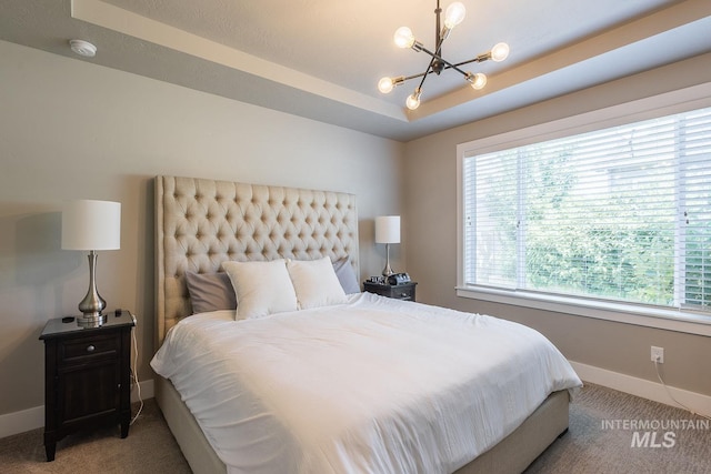 11706 W Lilium St, Star, ID 83669 - bedroom featuring light carpet, a chandelier, and a raised ceiling