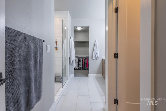 11706 W Lilium St, Star, ID 83669 - full bath with a shower stall, a walk in closet, and tile patterned floors