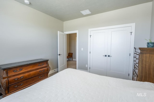 11706 W Lilium St, Star, ID 83669 - bedroom featuring a closet and a textured ceiling