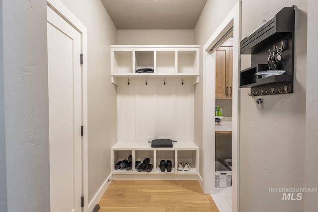 11706 W Lilium St, Star, ID 83669 - mudroom with light wood-style floors and baseboards