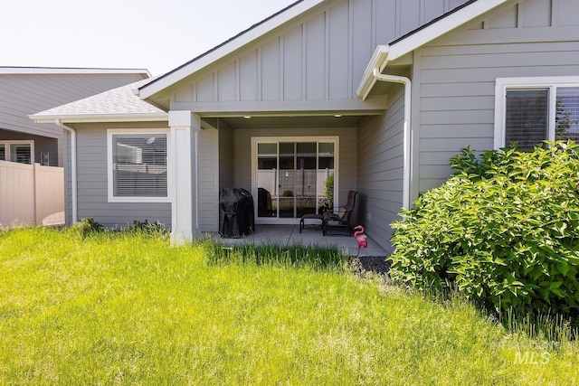 11706 W Lilium St, Star, ID 83669 - view of exterior entry featuring board and batten siding and a patio area