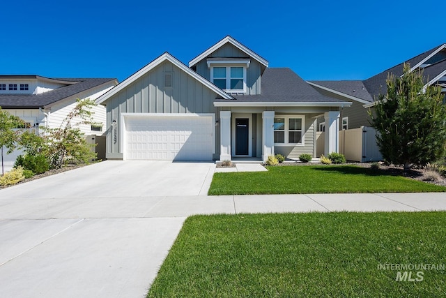 11706 W Lilium St, Star, ID 83669 - view of front facade featuring board and batten siding, concrete driveway, and an attached garage