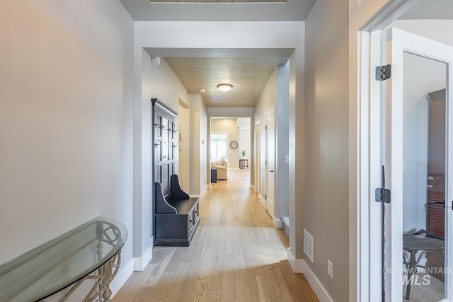 11706 W Lilium St, Star, ID 83669 - corridor with light wood-style flooring and baseboards