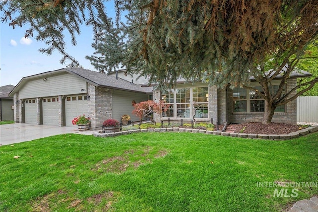 view of front of home with a garage and a front yard