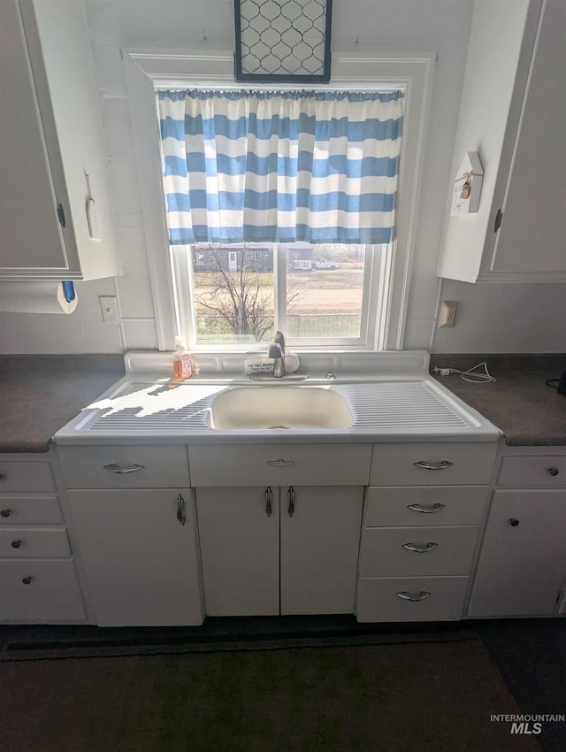 231 Willow Ave E, Fairfield, ID 83327 - kitchen with white cabinetry