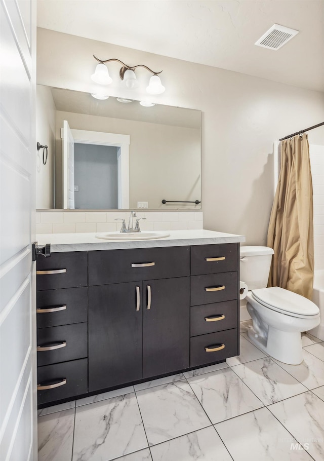 bathroom featuring visible vents, toilet, marble finish floor, and vanity