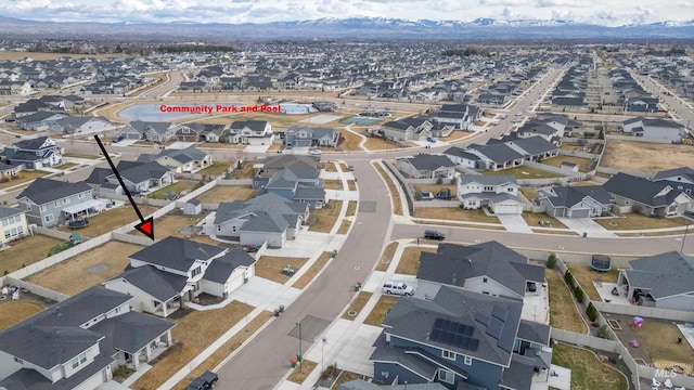 drone / aerial view featuring a mountain view and a residential view