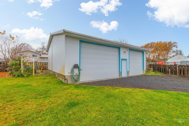 garage with a lawn