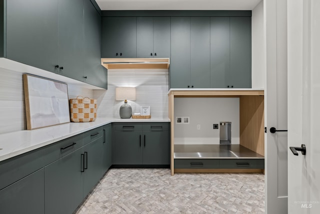 kitchen featuring decorative backsplash and gray cabinetry