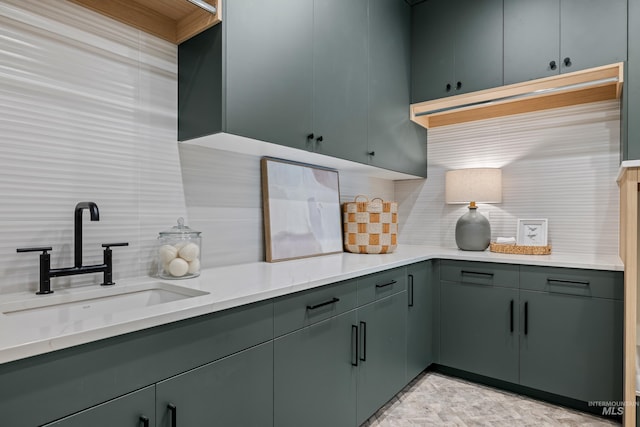 kitchen featuring sink and decorative backsplash