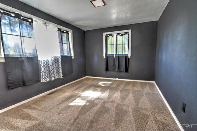 2912 S Harmony Ave, Boise, ID 83706 - empty room featuring plenty of natural light, carpet flooring, and baseboards