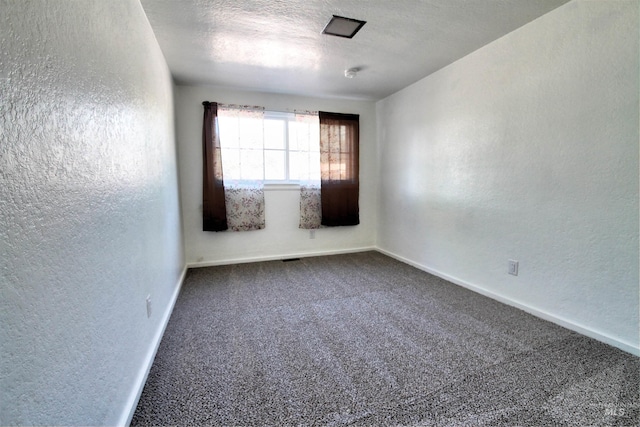 2912 S Harmony Ave, Boise, ID 83706 - empty room with a textured wall, dark carpet, and baseboards