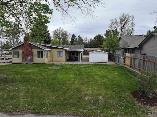 2912 S Harmony Ave, Boise, ID 83706 - back of property featuring a chimney and a patio area