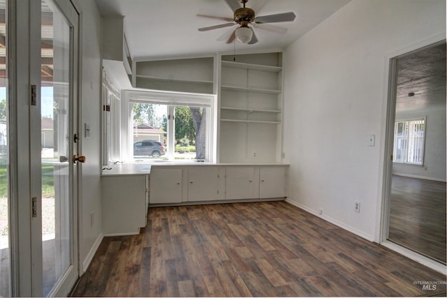 2912 S Harmony Ave, Boise, ID 83706 - unfurnished dining area with lofted ceiling, ceiling fan, dark wood-type flooring, baseboards, and built in shelves