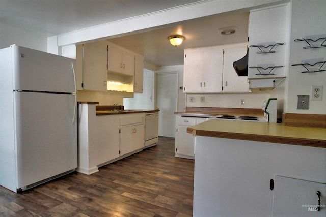2912 S Harmony Ave, Boise, ID 83706 - kitchen with white appliances, dark wood-style flooring, white cabinets, and a peninsula