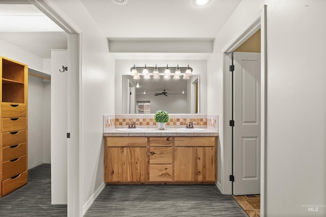 bathroom with vanity, backsplash, and ceiling fan