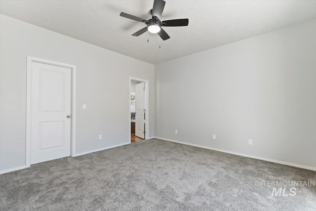 unfurnished bedroom with carpet, baseboards, and a ceiling fan