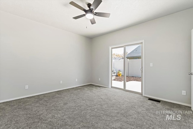 empty room with carpet, baseboards, and ceiling fan