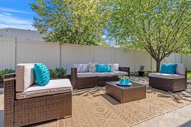 view of patio featuring outdoor lounge area and a fenced backyard