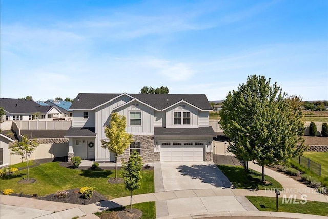 655 N Sevenoaks Ave, Eagle, ID 83616 - view of front of property featuring stone siding, board and batten siding, concrete driveway, and an attached garage