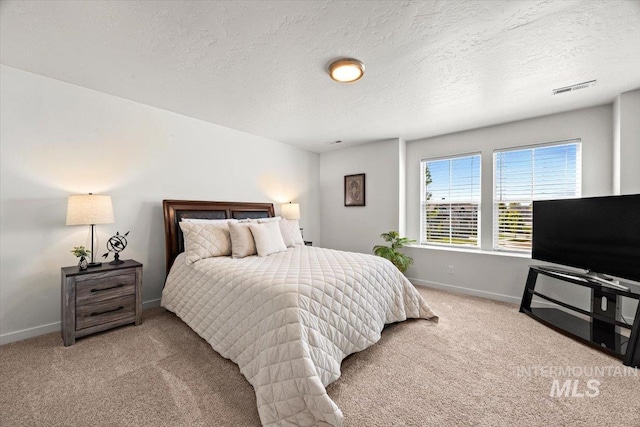 655 N Sevenoaks Ave, Eagle, ID 83616 - carpeted bedroom featuring baseboards and a textured ceiling