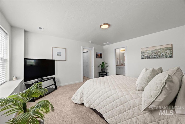 655 N Sevenoaks Ave, Eagle, ID 83616 - carpeted bedroom with baseboards and ensuite bathroom