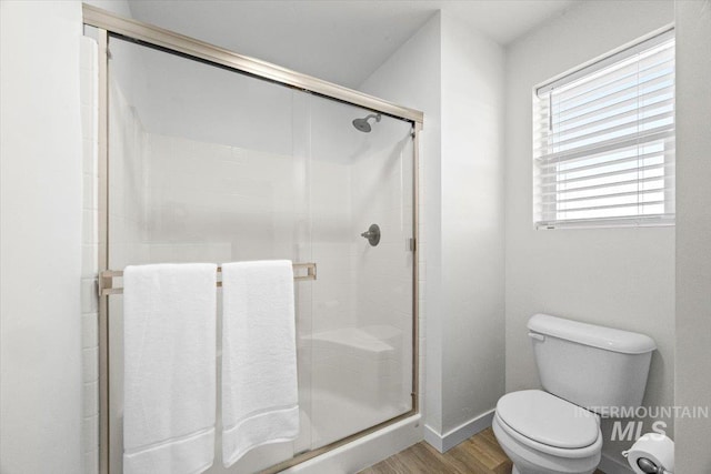 655 N Sevenoaks Ave, Eagle, ID 83616 - full bath featuring toilet, a stall shower, wood finished floors, and baseboards