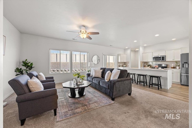 655 N Sevenoaks Ave, Eagle, ID 83616 - living area with a ceiling fan, light colored carpet, and recessed lighting