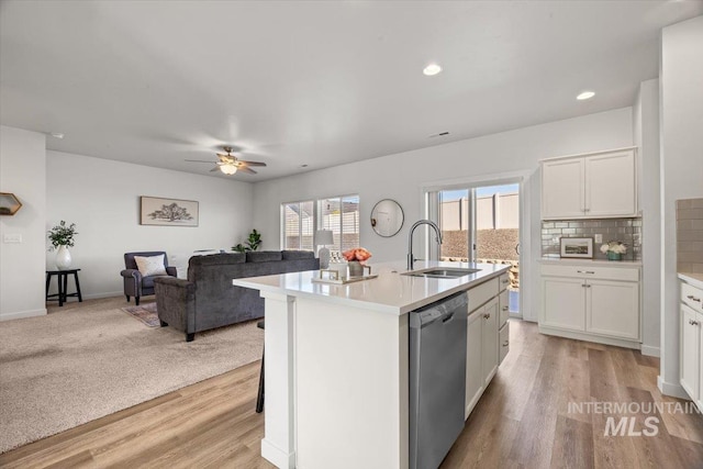 655 N Sevenoaks Ave, Eagle, ID 83616 - kitchen with dishwasher, a sink, light countertops, white cabinetry, and recessed lighting
