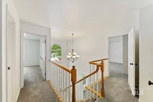 9874 W Whirlaway Ct, Boise, ID 83704 - hallway featuring carpet, an upstairs landing, a chandelier, and baseboards