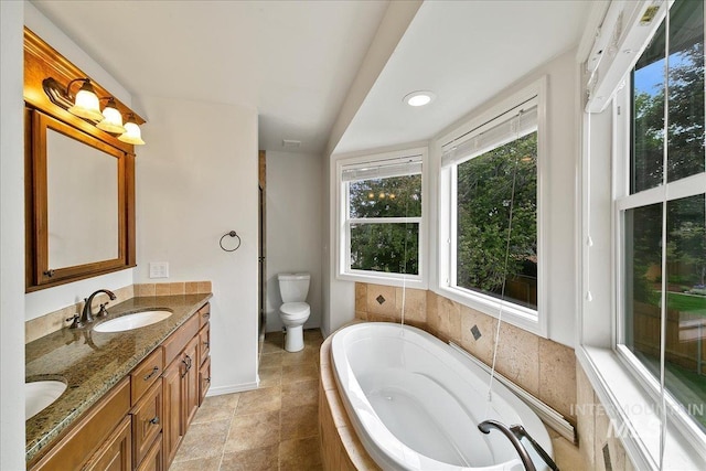 9874 W Whirlaway Ct, Boise, ID 83704 - full bath with a bath, double vanity, toilet, and baseboards