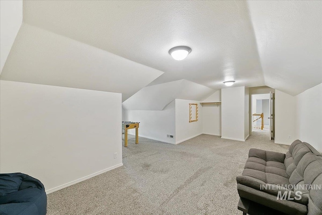 9874 W Whirlaway Ct, Boise, ID 83704 - additional living space featuring carpet, baseboards, lofted ceiling, and a textured ceiling