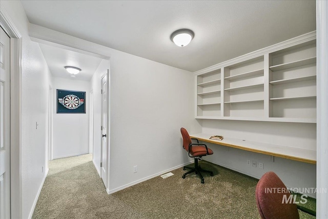 9874 W Whirlaway Ct, Boise, ID 83704 - home office with built in study area, carpet floors, and baseboards