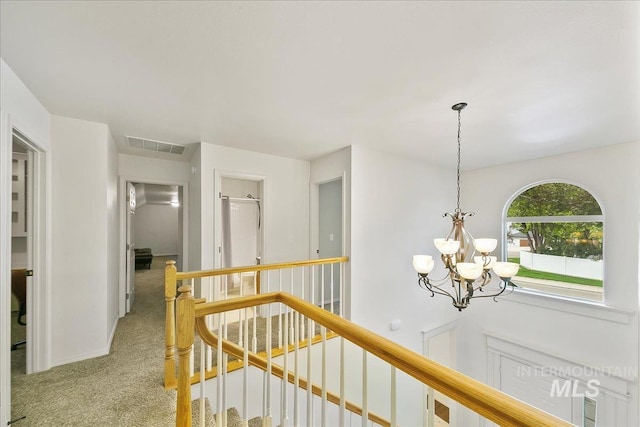 9874 W Whirlaway Ct, Boise, ID 83704 - corridor featuring an upstairs landing, carpet floors, and a chandelier